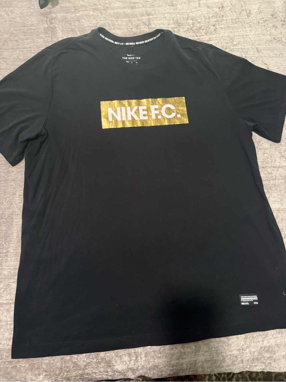 Nike Men’s Black T-Shirt with Gold NIKE F.C. Box Logo
